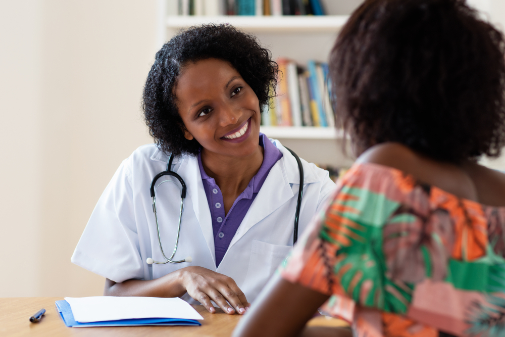 Woman consulting with her gynecologist about heavy menstrual bleeding.