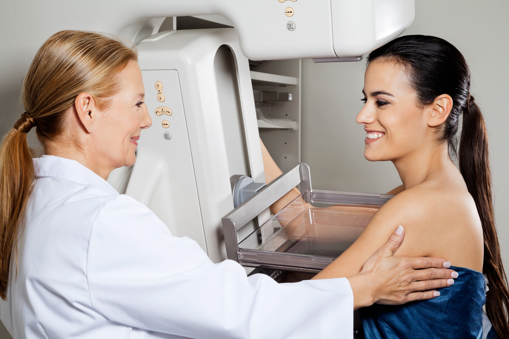 Mature,Female,Doctor,Assisting,Young,Patient,During,Mammogram,X-ray,Test.