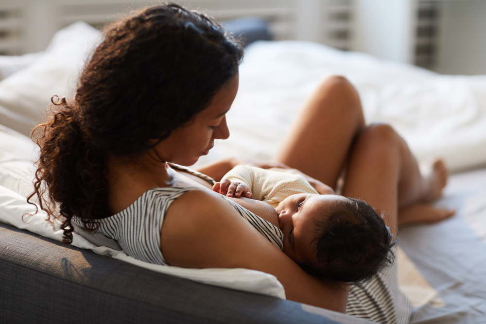 woman breastfeeding baby.