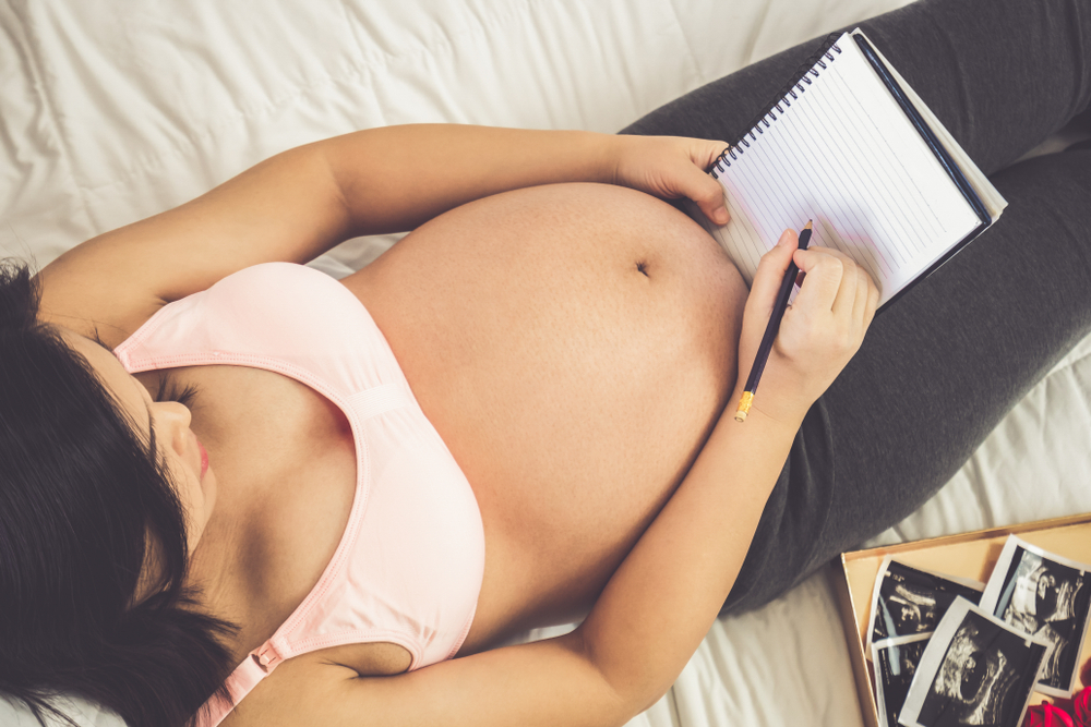 woman working on her birth plan.